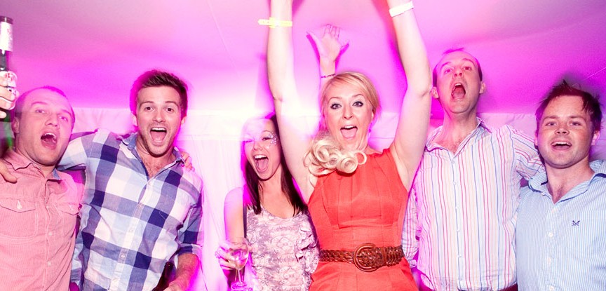 Friends dancing arm in arm