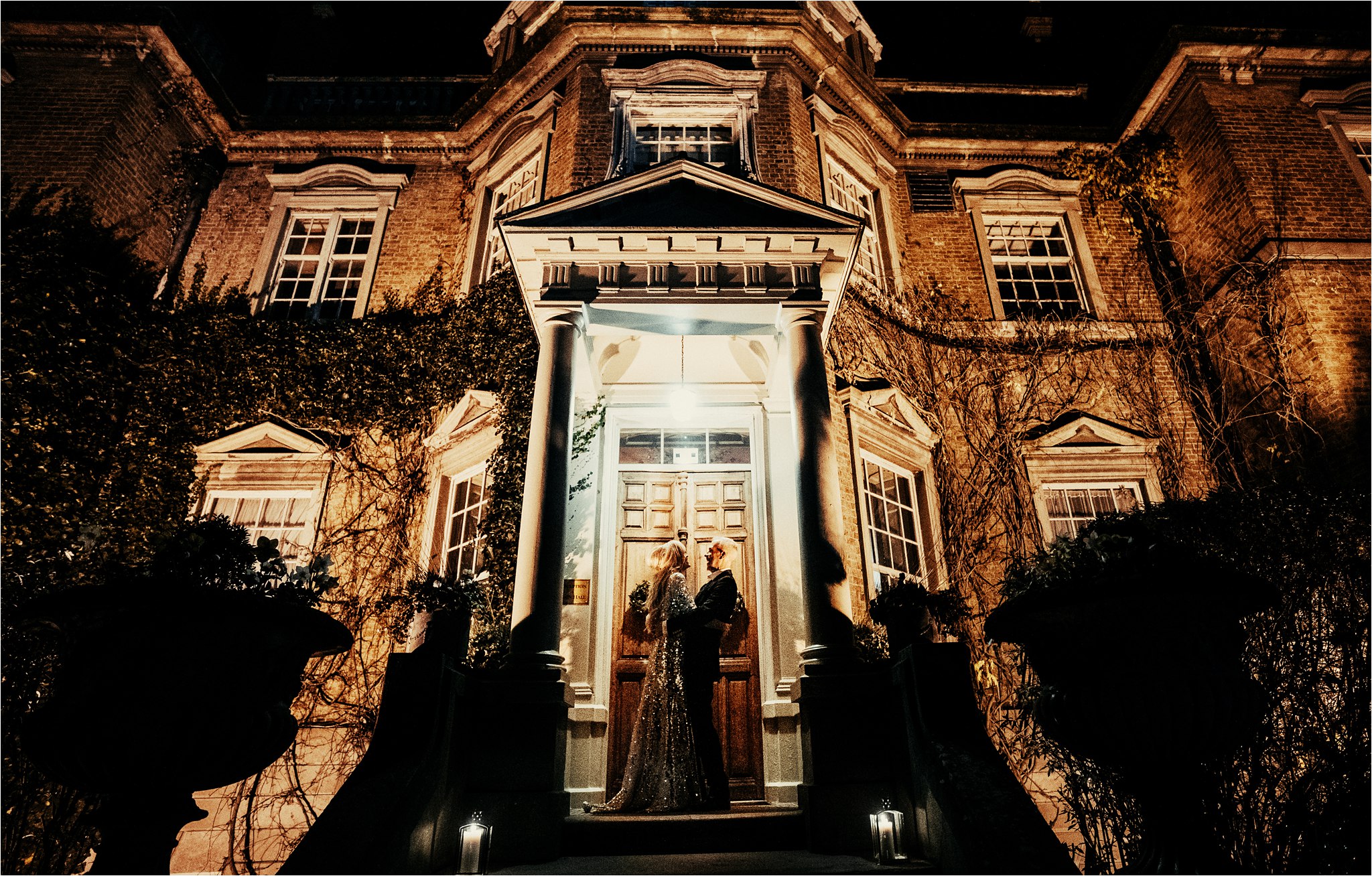 A weddning couple outside a Hampton Court House